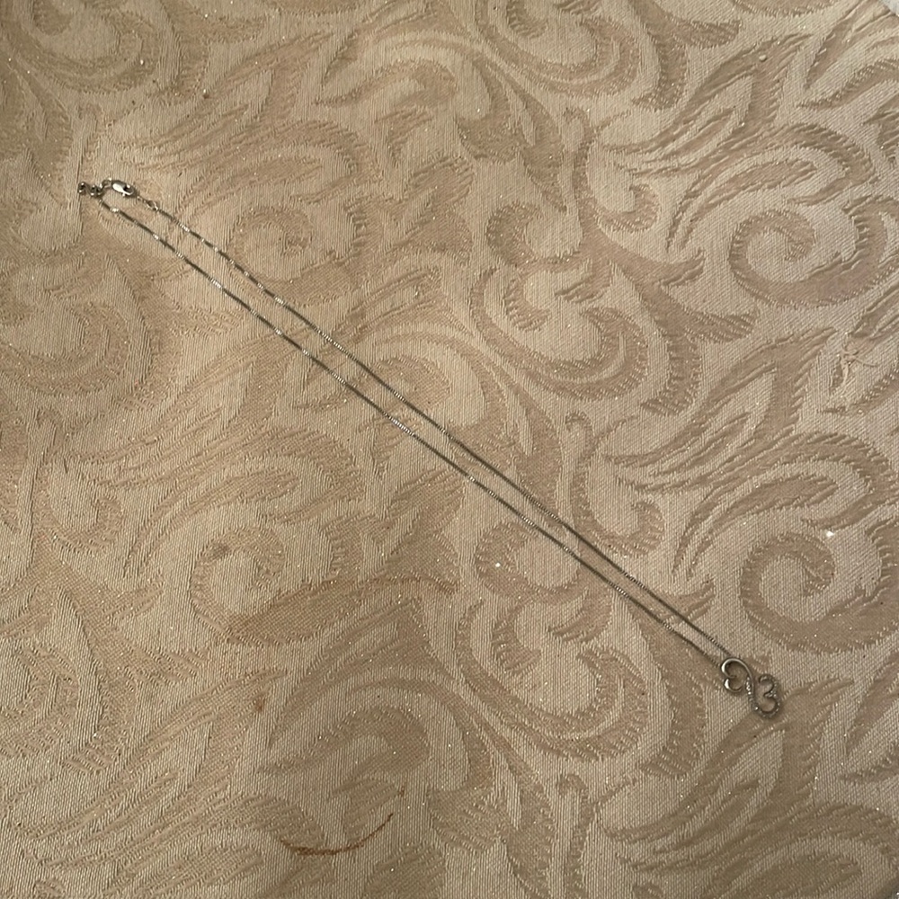 Jane Seymour Open Heart sterling silver necklace with diamonds.